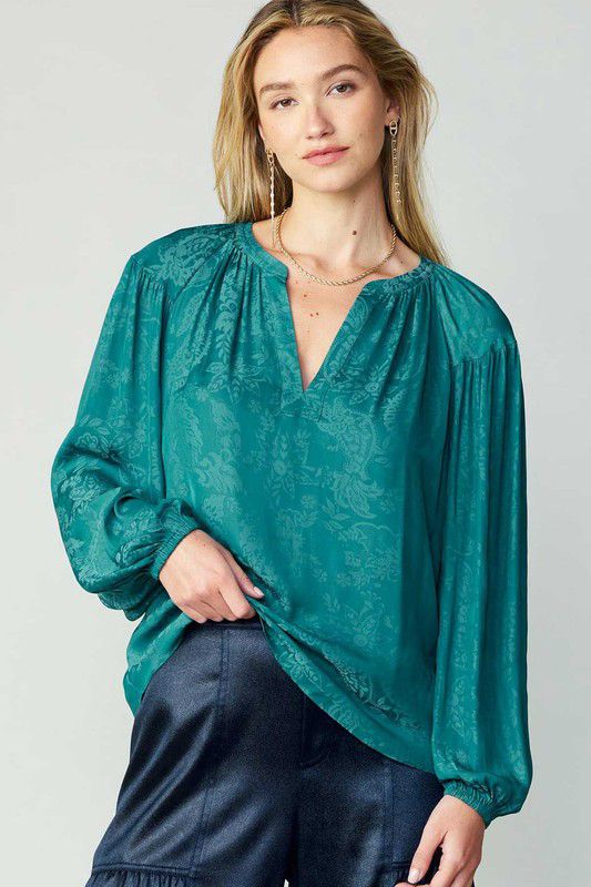 Blusa satinada con brocado