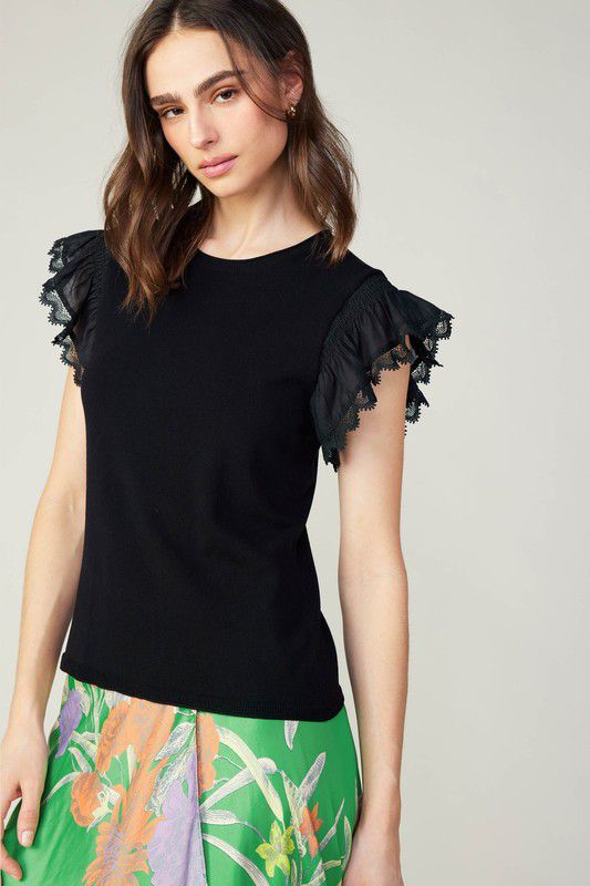 Blusa de cuerpo tejido y mangas en contraste con detalle