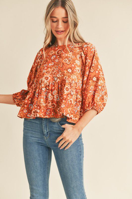 Blusa estampada flores con volante en ruedo