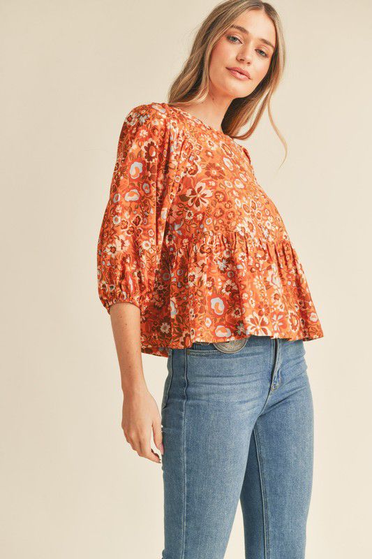 Blusa estampada flores con volante en ruedo